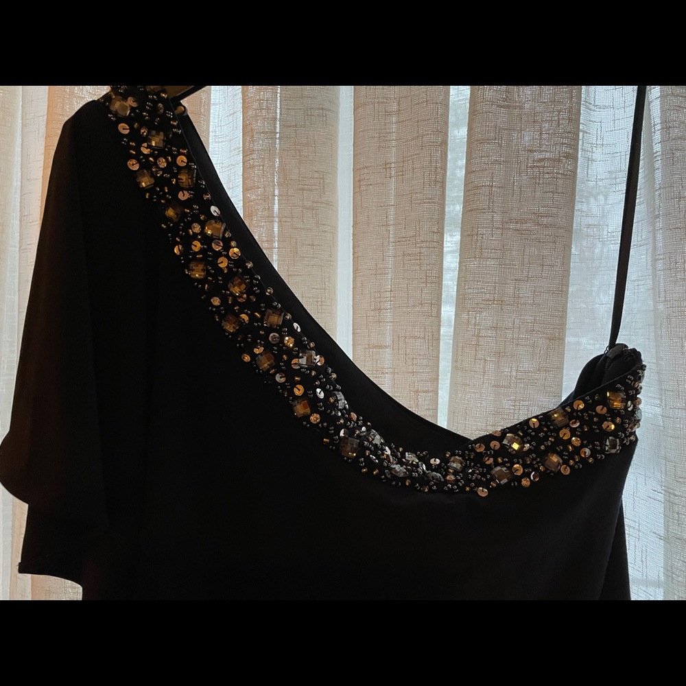 Dark blue/black evening dress. Sequins add a nice touch to the dress.